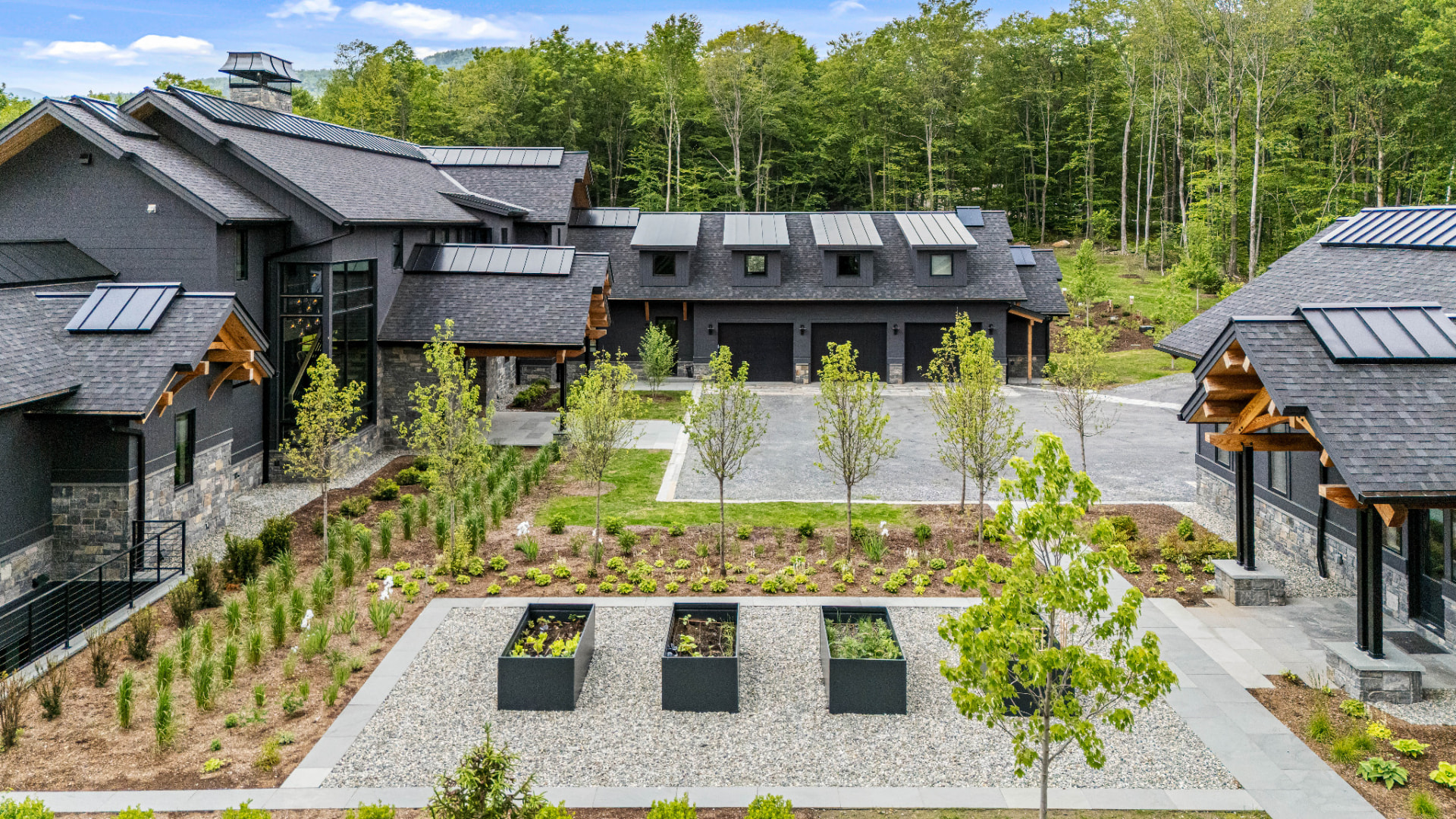 Aerial view of the courtyard, garage wing, and painted exteriors