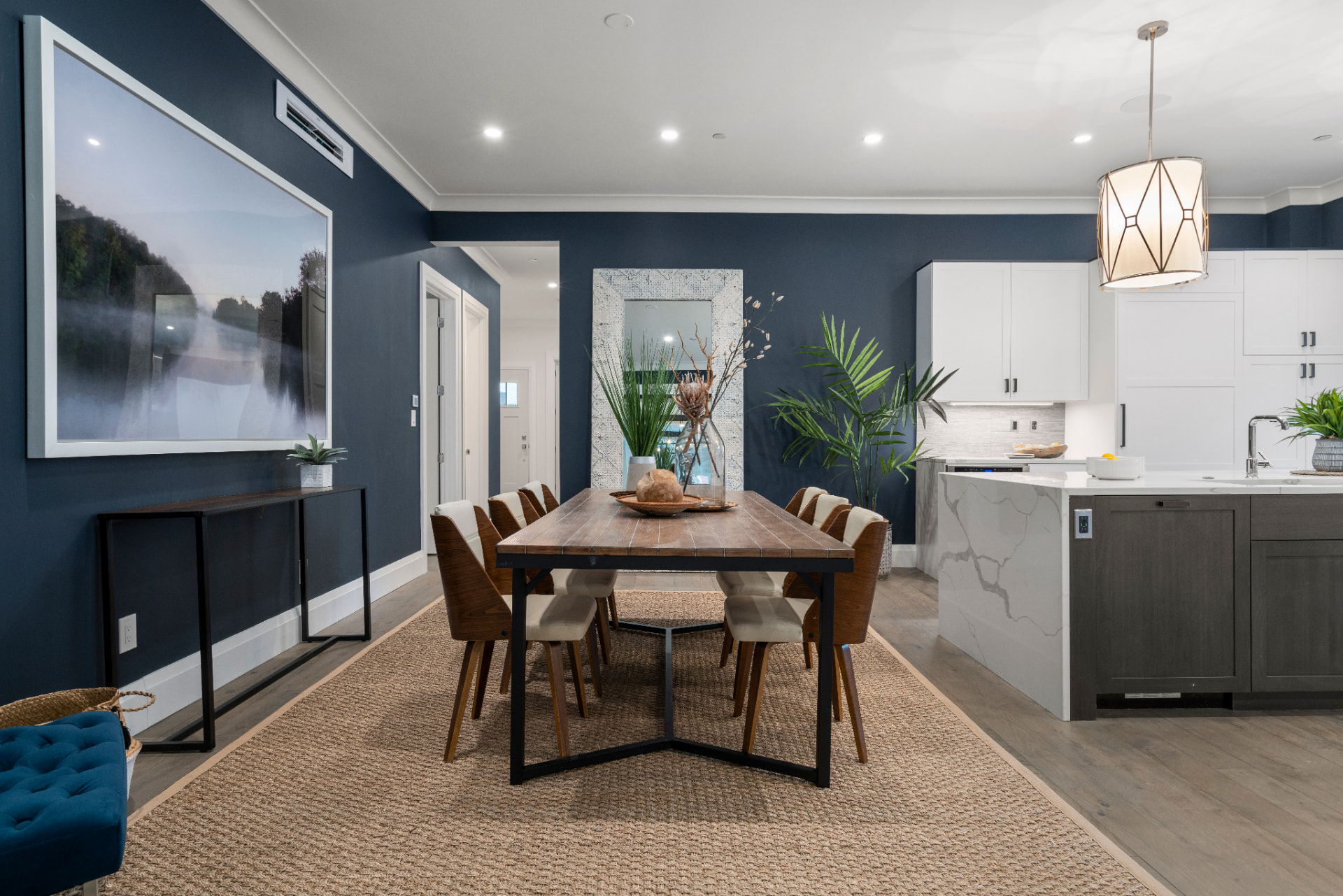 Dining room painted in a deep navy accent color with white trim