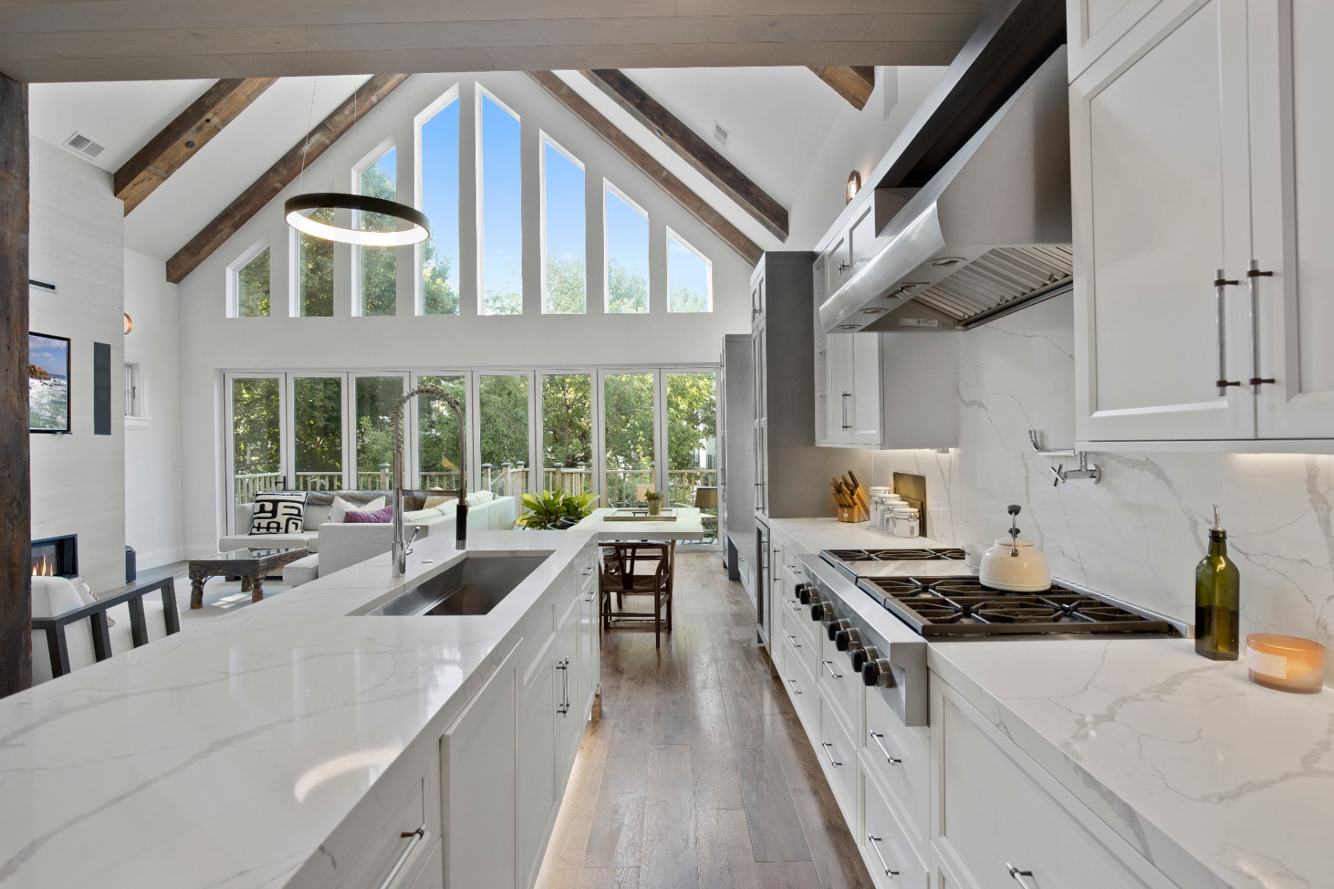Penthouse kitchen with crisp white cabinetry and trim work