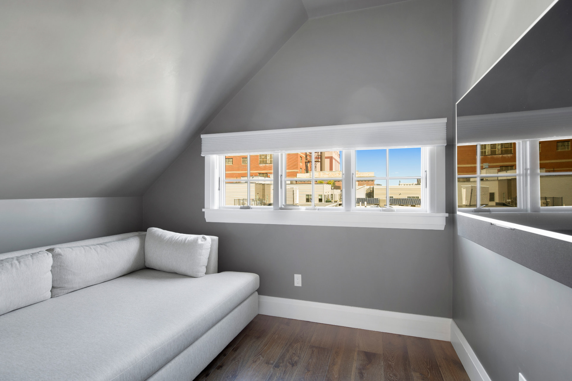 Loft nook painted in soft grey with white baseboards