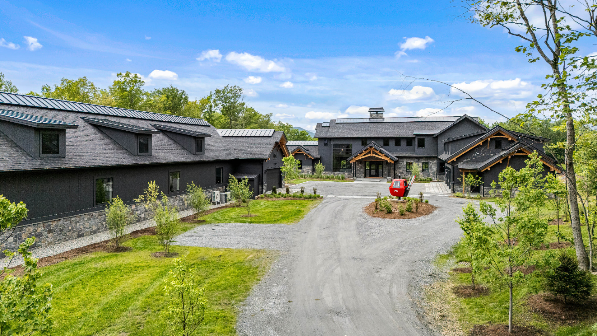 Aerial view of the estate entry drive and painted exterior wings