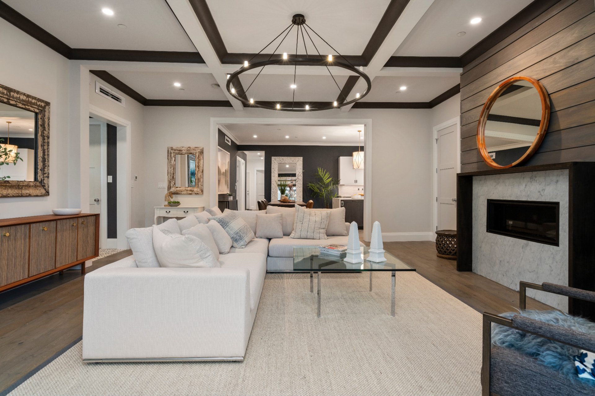 Living room fireplace wall with wood paneling and painted trim