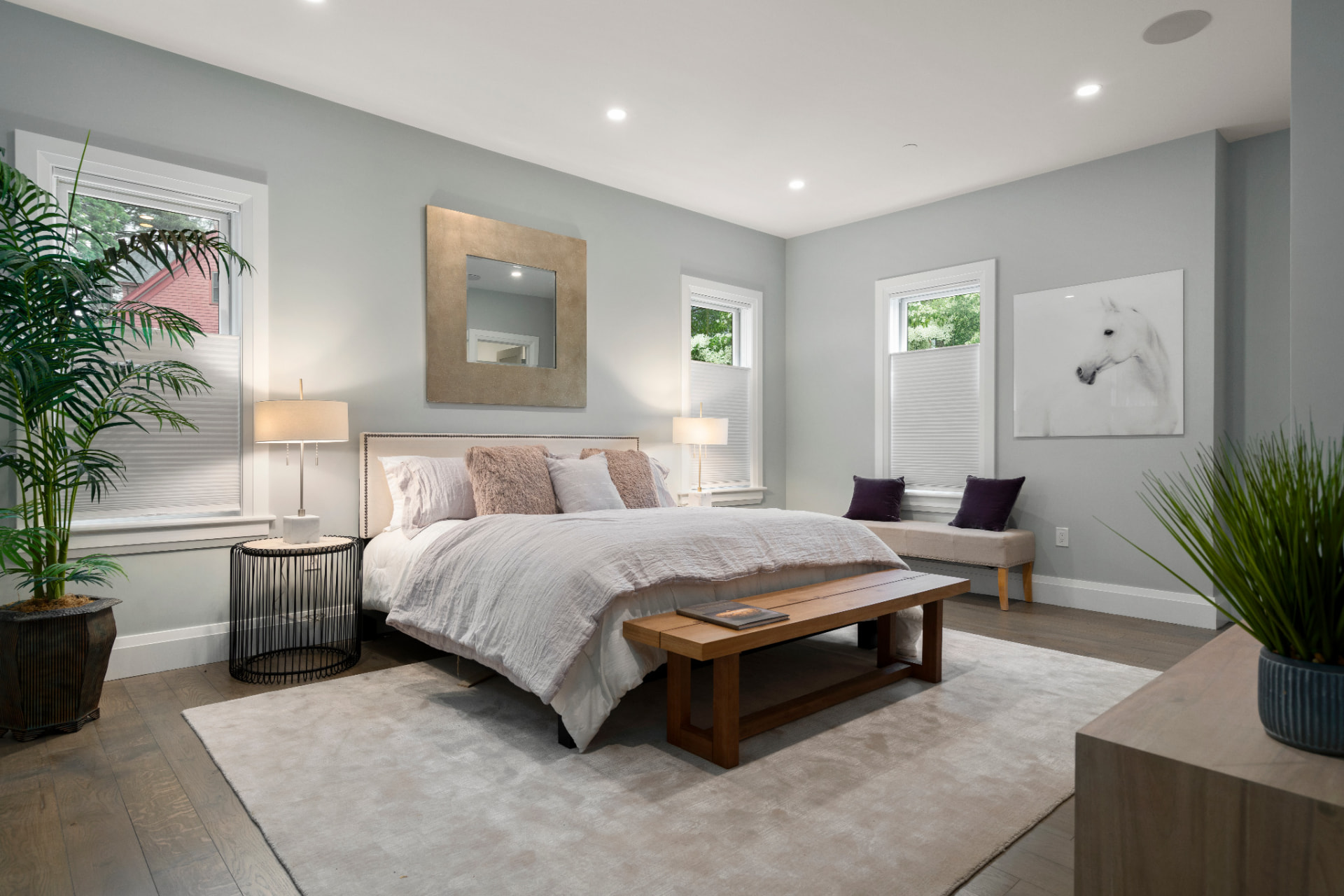 Bedroom painted in a soft grey with bright white ceiling and trim